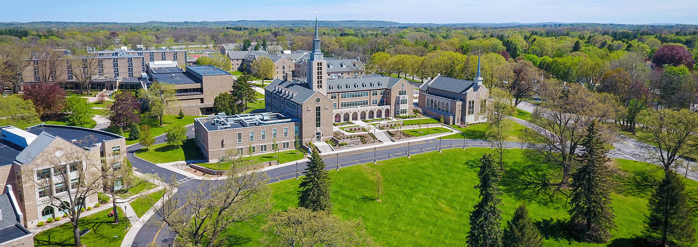 Aerial view of ϲַȫ Fisher University in spring with iconic Kearney Hall with steeple in the forefront.