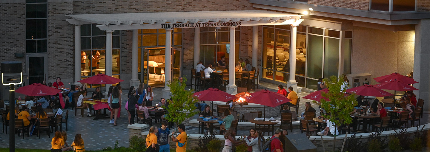 Students mingle and chat with one another at the Terrace at Tepas Commons on the ϲַȫ Fisher University campus