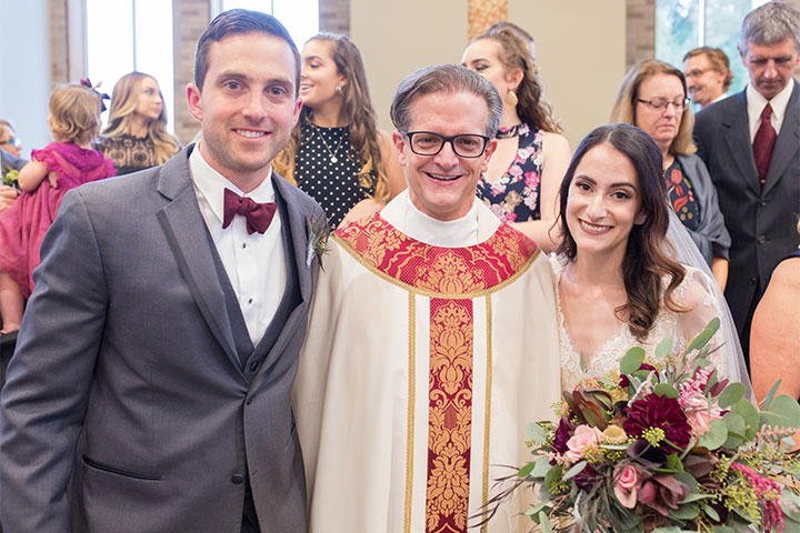 Everything about our experience perfectly embodies what it means to be a part of the ϲַȫ Fisher College family. -David '13 and Caitlin '15 Van Gorder with Father Mannara